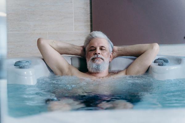 Soaking in a hot tub has the 'same health benefits' as going for a  30-minute jog, scientists reveal